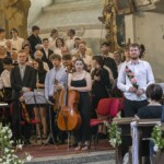 Koncert v Heřmanově Městci ke 100. výročí sboru SMETANA a první koncert jejich Hudebního léta v HM - společně s orchestrem a sborem Konzervatoře Pardubice. Děkovačka - dirigent Josef Mejsnar.